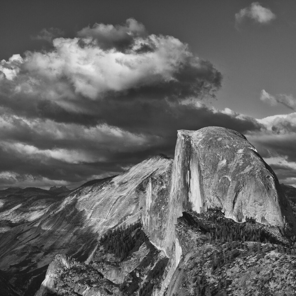 United States of America, California, Yoesmite National Park. The iconic view of Half Dome viewed from Glacier Point at sunset.