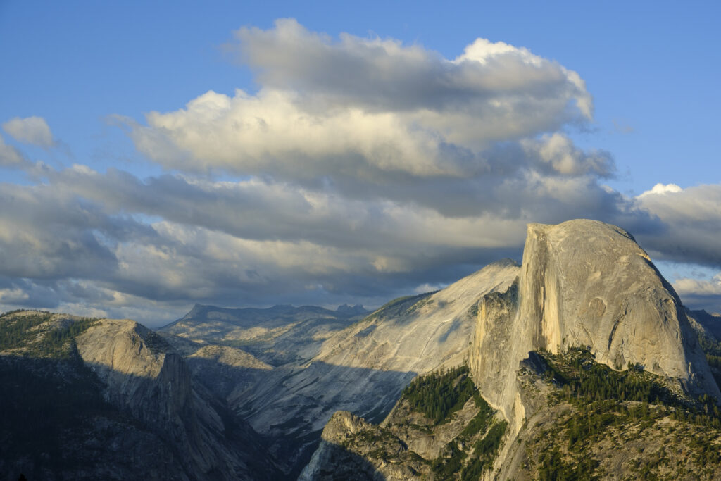 United States of America, California, Yoesmite National Park. The iconic view of Half Dome viewed from Glacier Point at sunset.