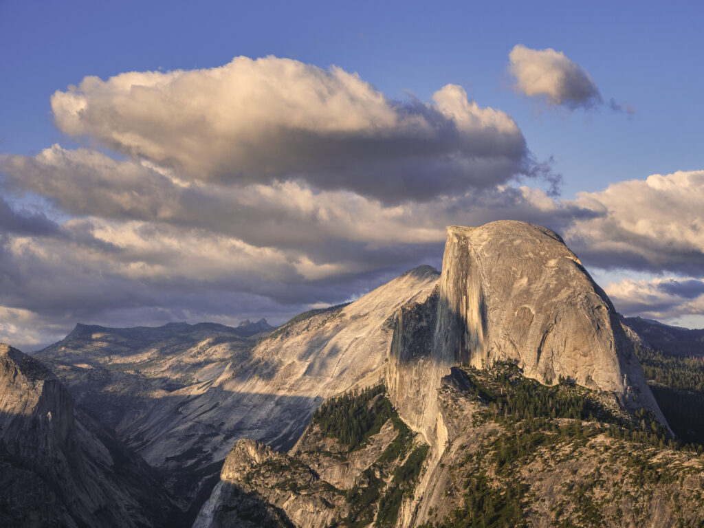 United States of America, California, Yoesmite National Park. The iconic view of Half Dome viewed from Glacier Point at sunset.