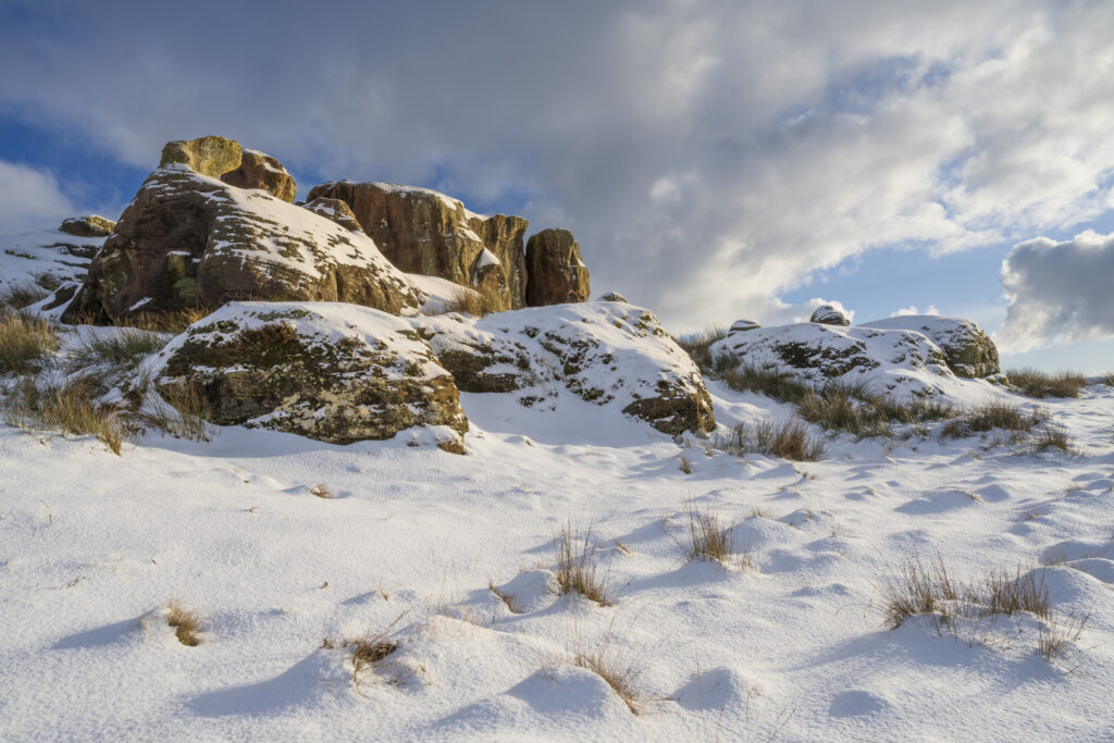 England, Northumberland, Caller Crag & Boulders. Late afternoon light illuminates the snow covered features of Caller Crag & Boulders.
