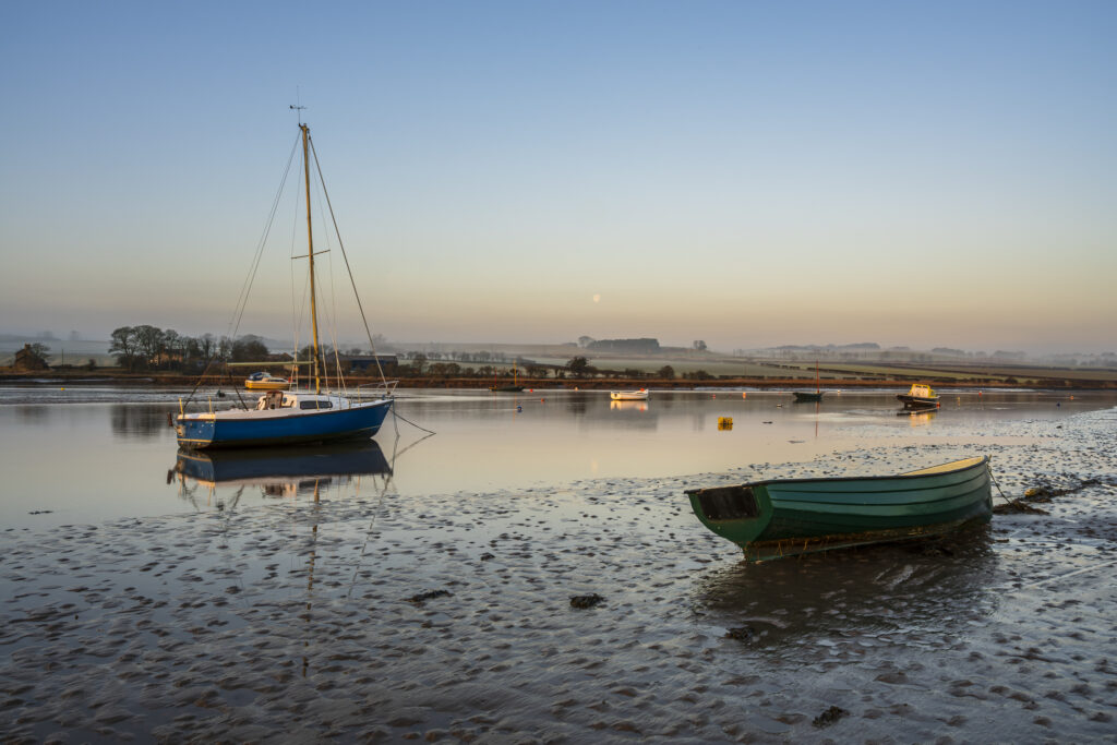England, Northumberland, Alnmouth. The Aln estuary near Alnmouth at low tide on a misty morning.