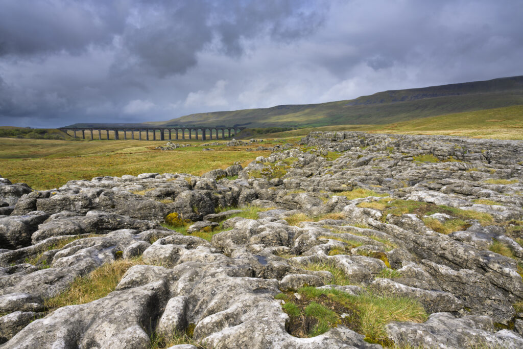England, North Yorkshire, Yorkshire Dales National Park. Ribblehead Viaduct, a railway viaduct crossing the valley of the River Ribble at Ribblehead.