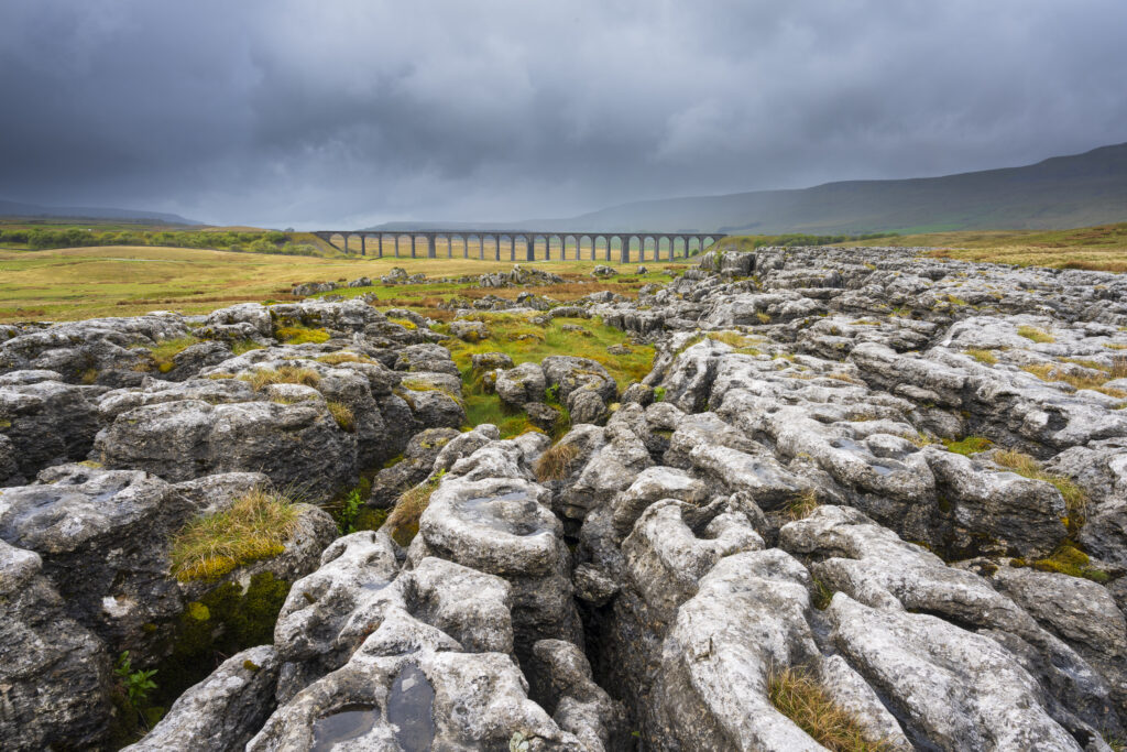 England, North Yorkshire, Yorkshire Dales National Park. Ribblehead Viaduct, a railway viaduct crossing the valley of the River Ribble at Ribblehead.