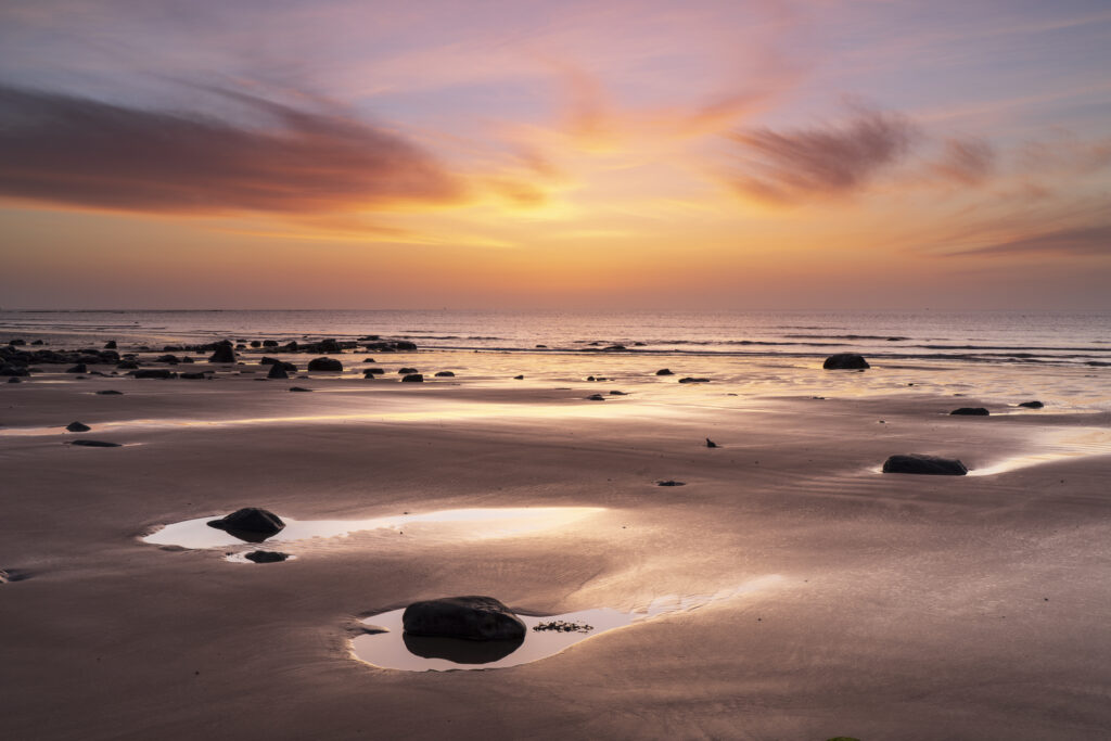 England, Northumberland, Northumberland Heritage Coast. Dawn at Hadston Scars near Togston Links, located at the northern end of Druridge Bay in Northumberland.