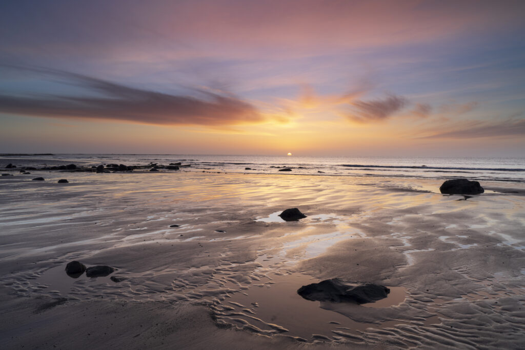 England, Northumberland, Northumberland Heritage Coast. Dawn at Hadston Scars near Togston Links, located at the northern end of Druridge Bay in Northumberland.