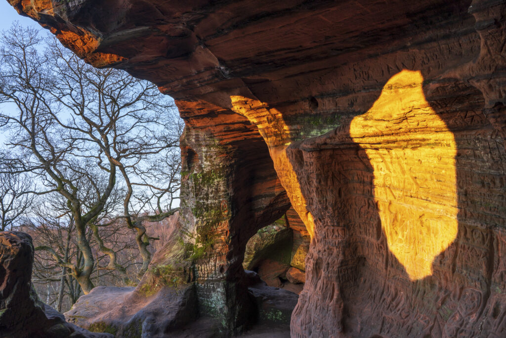 England, West Midlands, Kinver Edge. Carved graffiti in the sandstone walls of the caves in Nannys Rock.