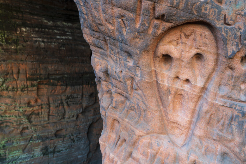 England, West Midlands, Kinver Edge. Carved graffiti in the sandstone walls of the caves in Nannys Rock.
