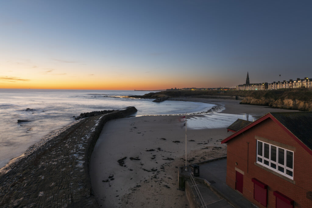 England, Tyne and Wear, Cullercoats. Cullercoats Bay photographed at dawn.