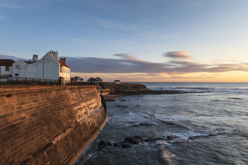 England, Tyne and Wear, Cullercoats. Cullercoats Bay photographed at dawn.