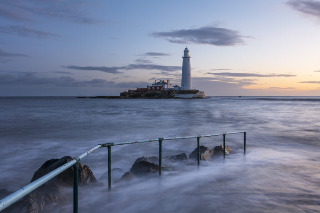 England, Tyne and Wear, St Mary's Island. Pre-dawn at high tide with the north sea covering the causeway to St Mary's Island and lighthouse, a popular location near Whitley Bay.
