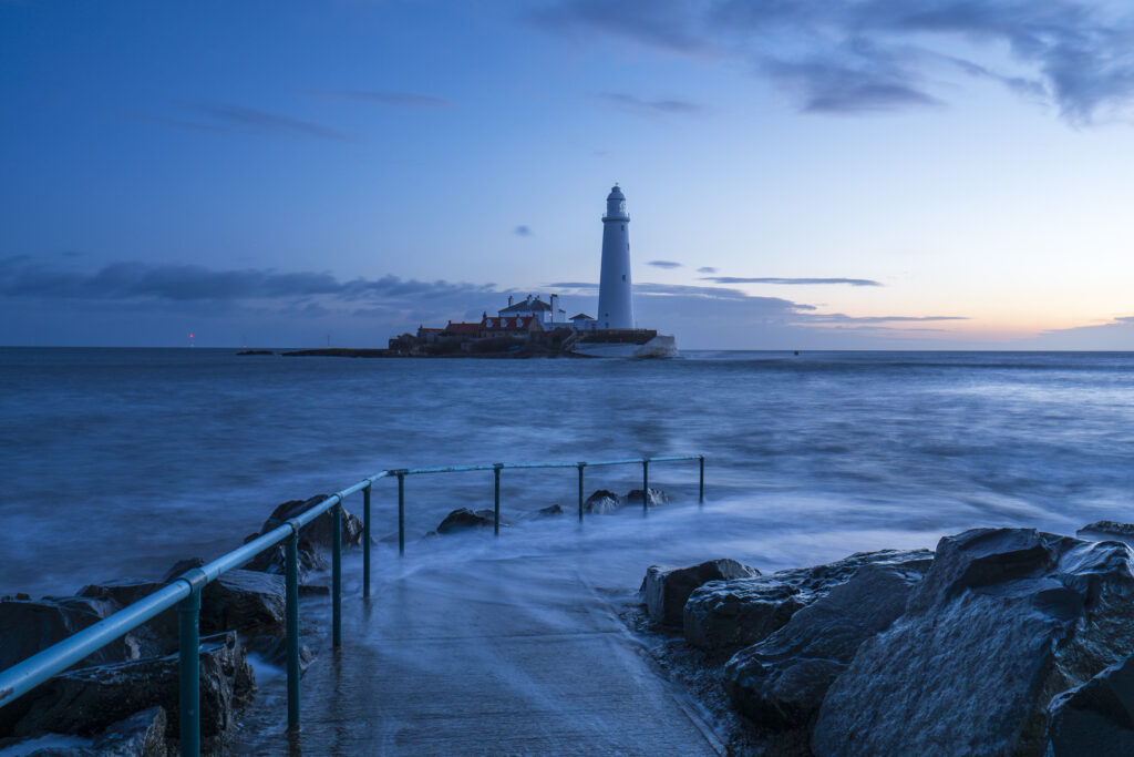 England, Tyne and Wear, St Mary's Island. Pre-dawn at high tide with the north sea covering the causeway to St Mary's Island and lighthouse, a popular location near Whitley Bay.