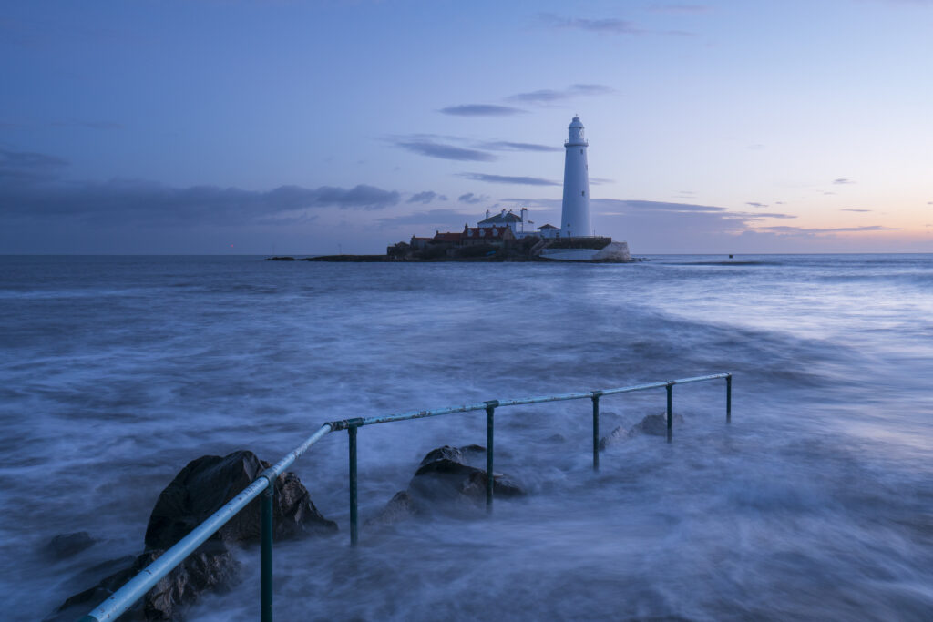 England, Tyne and Wear, St Mary's Island. Pre-dawn at high tide with the north sea covering the causeway to St Mary's Island and lighthouse, a popular location near Whitley Bay.