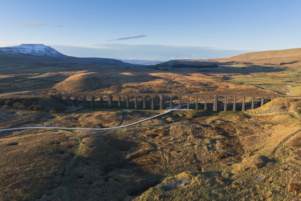 England, North Yorkshire, Yorkshire Dales National Park. Ribblehead Viaduct, a railway viaduct crossing the valley of the River Ribble at Ribblehead.
