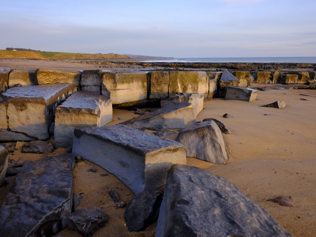 England, Northumberland, Cocklawburn Beach. The unique limestone geology of Cocklawburn Beach viewed at dawn.