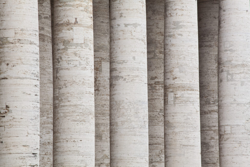 Italy, Lazio, Rome. Detail shot of marble pillars surrounding the Piazza San Pietro in Vatican City.
