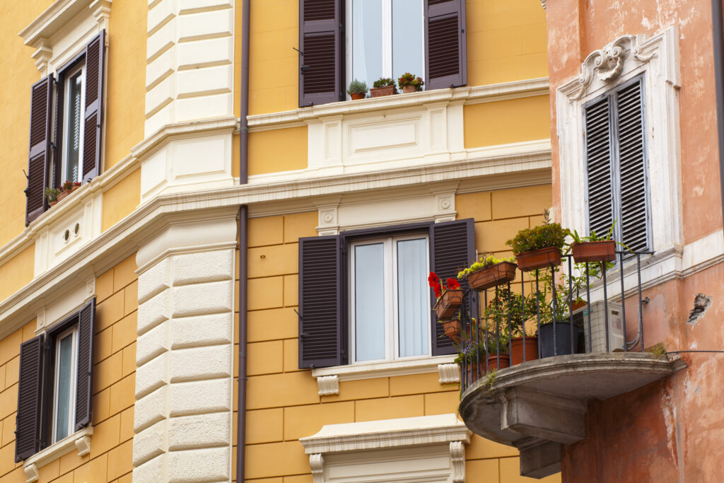 Italy, Lazio, Rome. Plants on a typical Rome residential apartment balcony.
