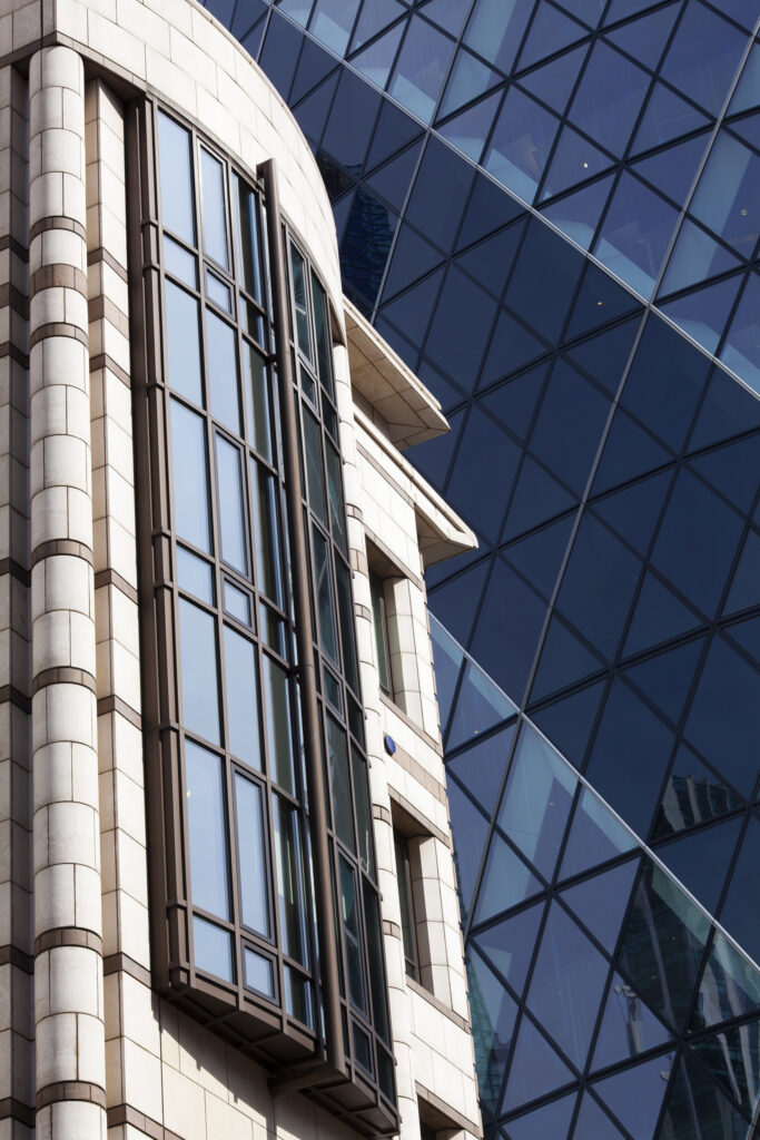 England, Greater London, The City of London. Abstract view of modern architecture including the famous Gherkin building, in the financial square mile in the City of London.
