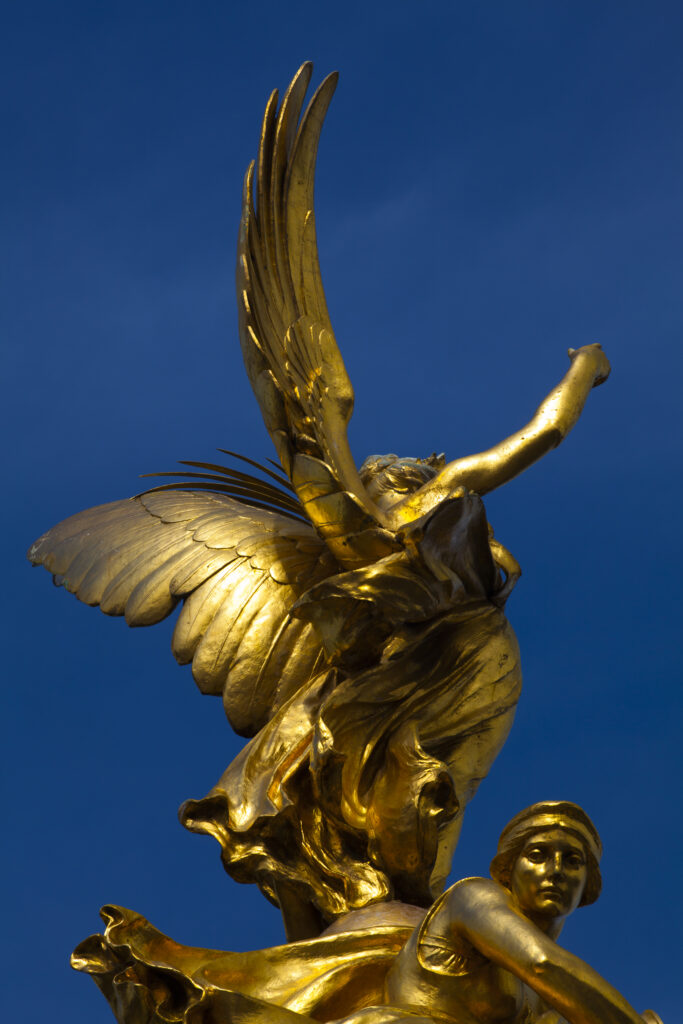 England, Greater London, City of Westminster. Statue of Victory on top of the Victoria Memorial in Queen's Garden near Buckingham Palace.