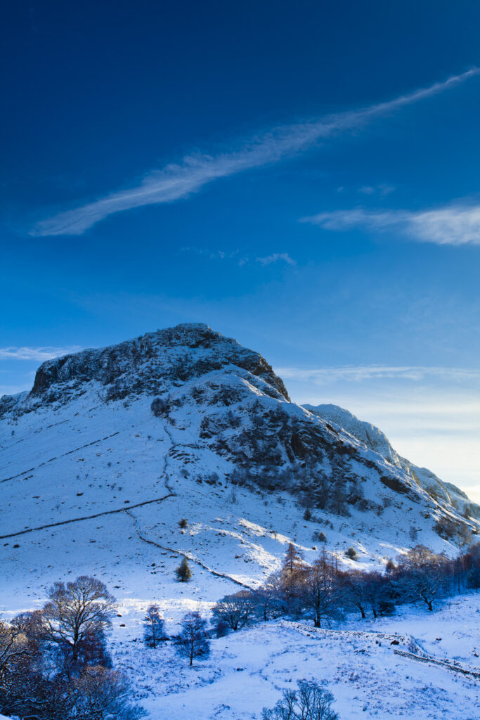 England, Cumbria, The Lake District. The Snow covered Stonethwaite Valley, looking towards Eagle Crag and the Langstrath Valley.