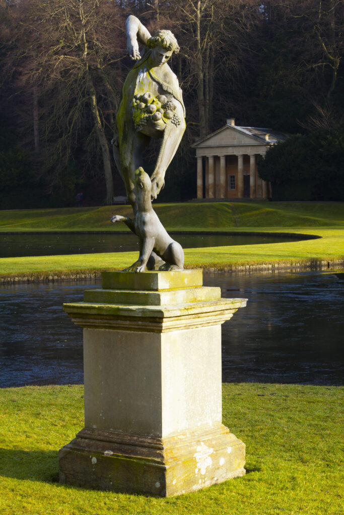England, North Yorkshire, Fountains Abbey and Studley Royal World Heritage Site. Statue near the water gardens which from part of the Fountains Abbey and Studley Royal World Heritage Site located near Ripon.