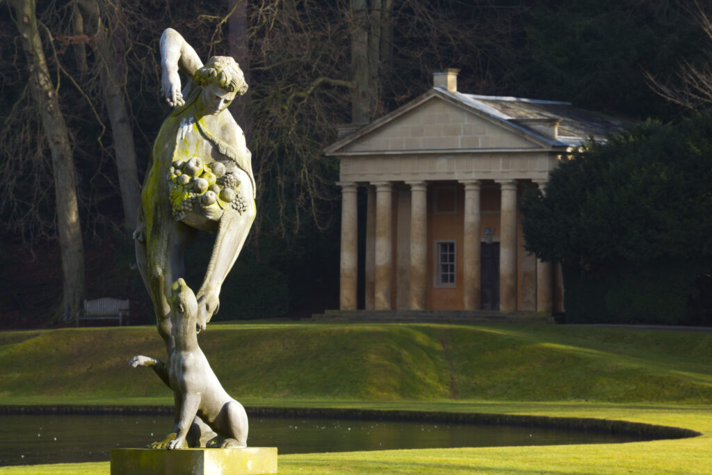 England, North Yorkshire, Fountains Abbey and Studley Royal World Heritage Site. Statue near the water gardens which from part of the Fountains Abbey and Studley Royal World Heritage Site located near Ripon.