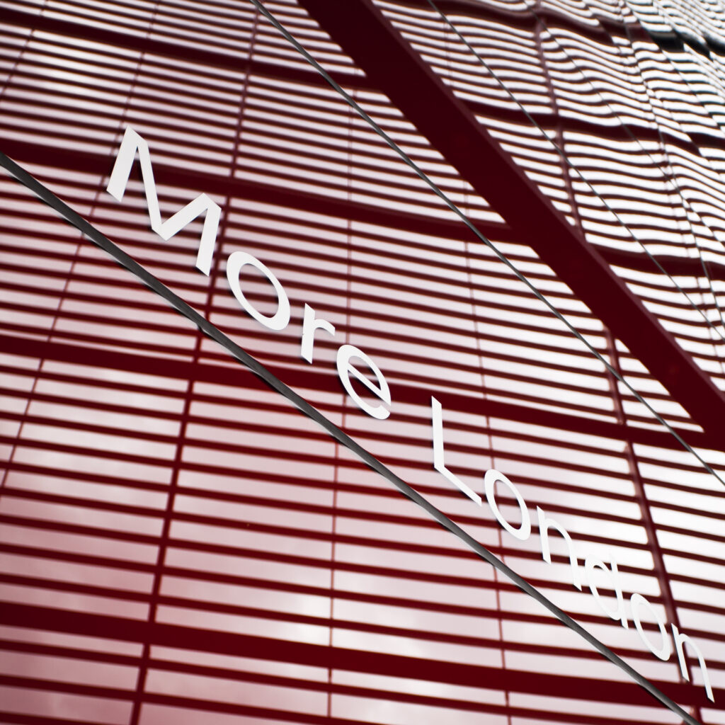 England, Greater London, Southwark. 'More London' caption displayed on the '6 More London Place' office space development near the River Thames.