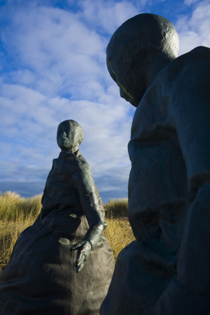 England, Tyne & Wear, South Shields. Bronze statues forming the "Conversation Piece" artwork located near Little haven Beach.