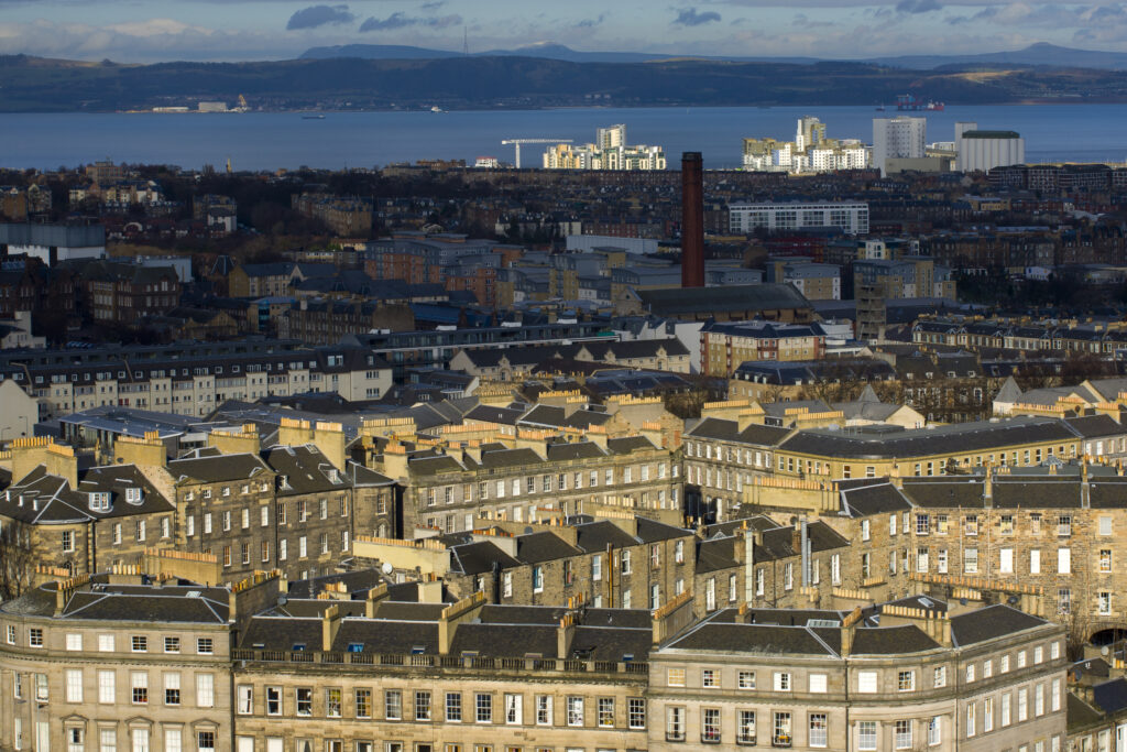 Scotland, Edinburgh, Calton Hill. Looking across Edinburgh City New Town to The Firth of Forth.
