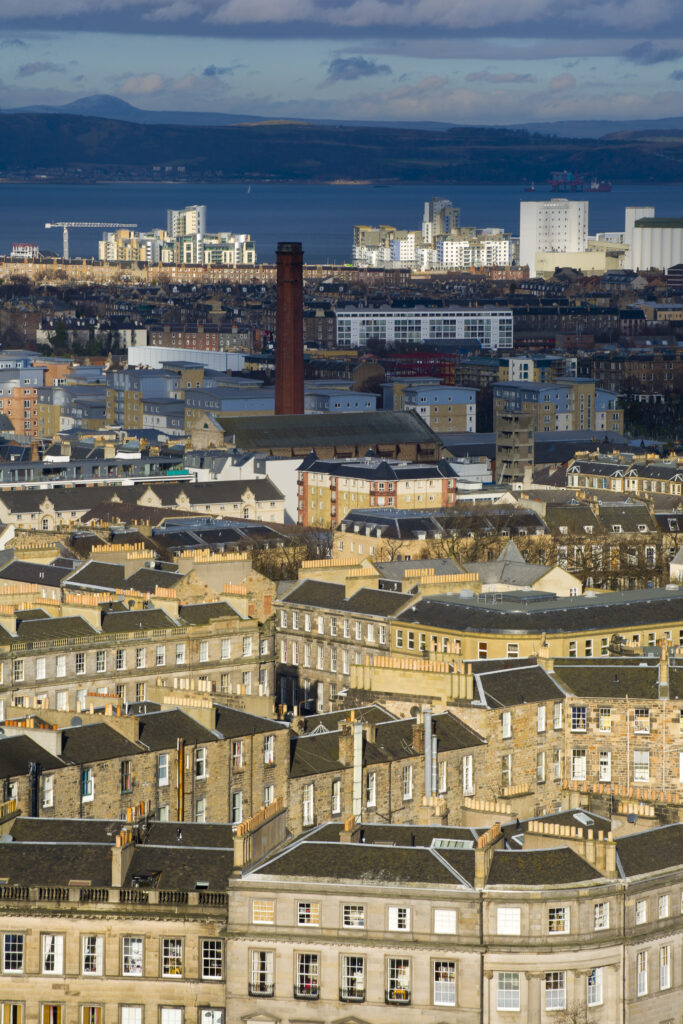 Scotland, Edinburgh, Calton Hill. Looking across Edinburgh City New Town to The Firth of Forth.