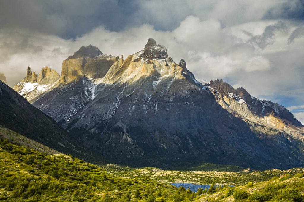 Chile, Southern Patagonia, Torres Del Paine National Park. Late afternoon light illuminates the peaks of the Cuernos del Paine.