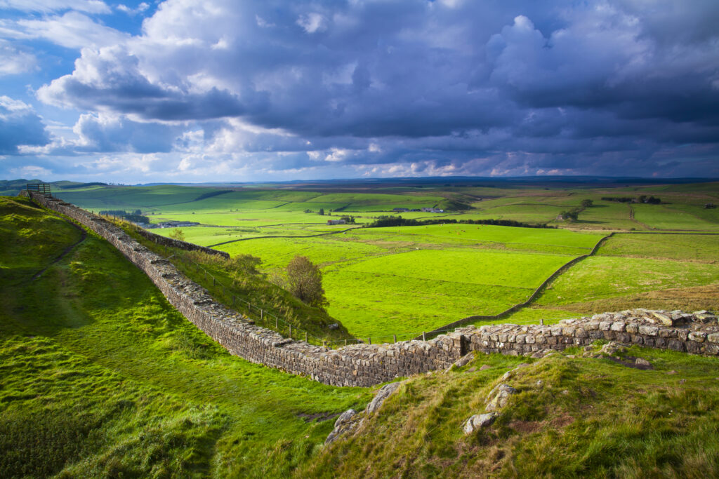 England, Northumberland, Northumberland National Park. A well preserved stretch of Hadrian's Wall passing along Caw Gap.