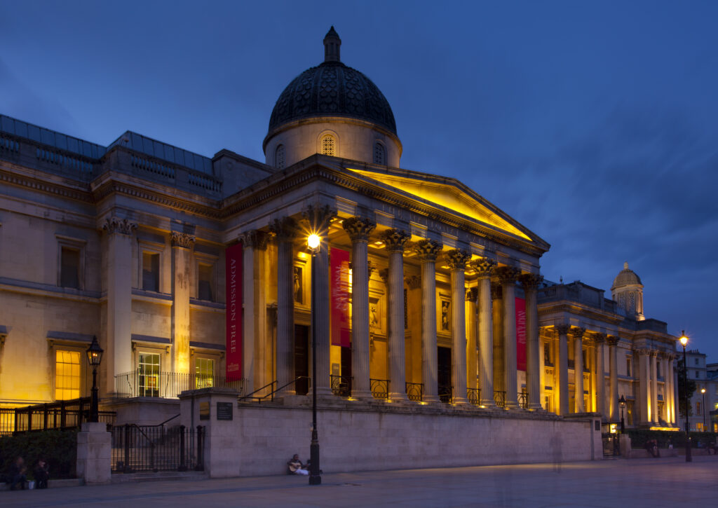 England, Greater London, City of Westminster. The National Gallery located in Trafalgar Square, a popular tourist destination in London, photographed at dusk.