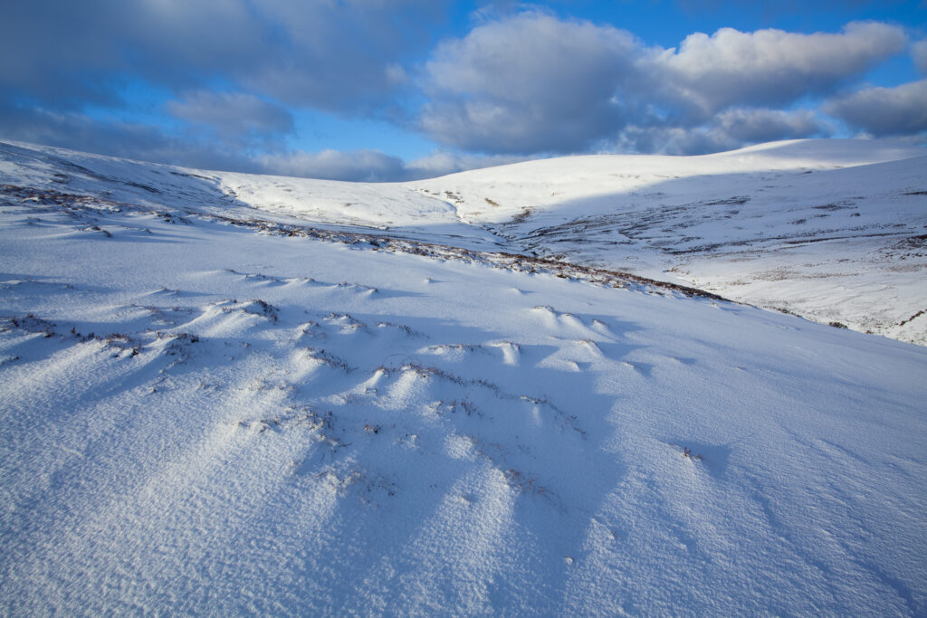England, Northumberland, Northumberland National Park. Snow on the Cheviot Hills near Comb Fell and the Breamish Valley.