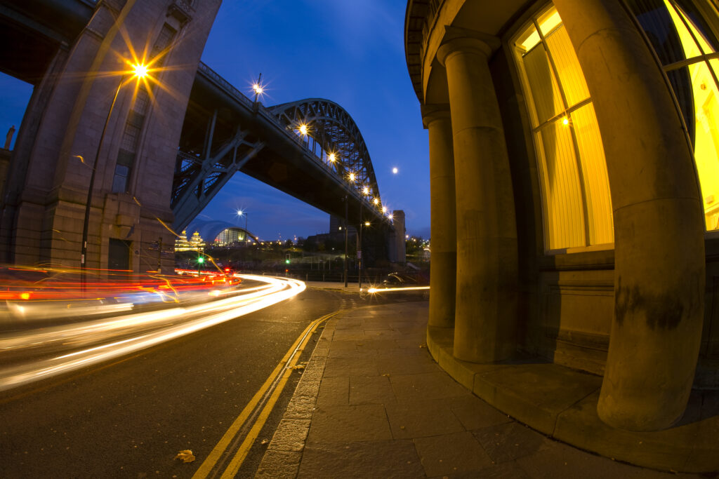 England, Tyne and Wear, Newcastle Upon Tyne. Rush hour traffic near the Tyne Bridge and the Guildhall.