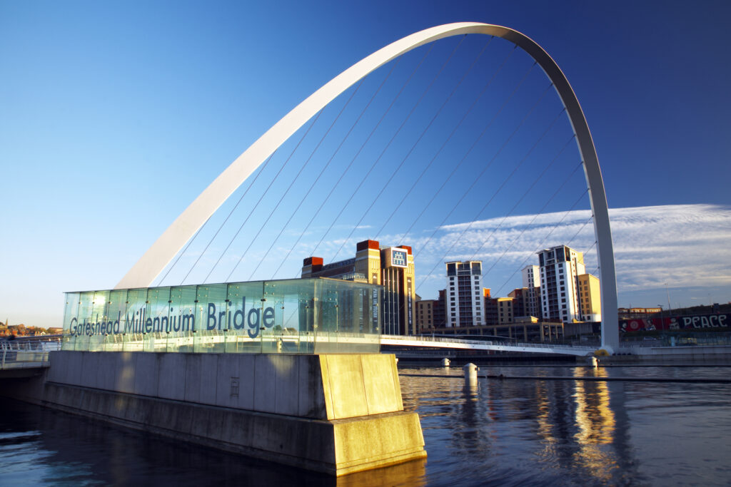 England, Tyne & Wear, Newcastle Upon Tyne. The Millennium Bridge and the river Tyne, viewed from the Newcastle upon tyne quayside