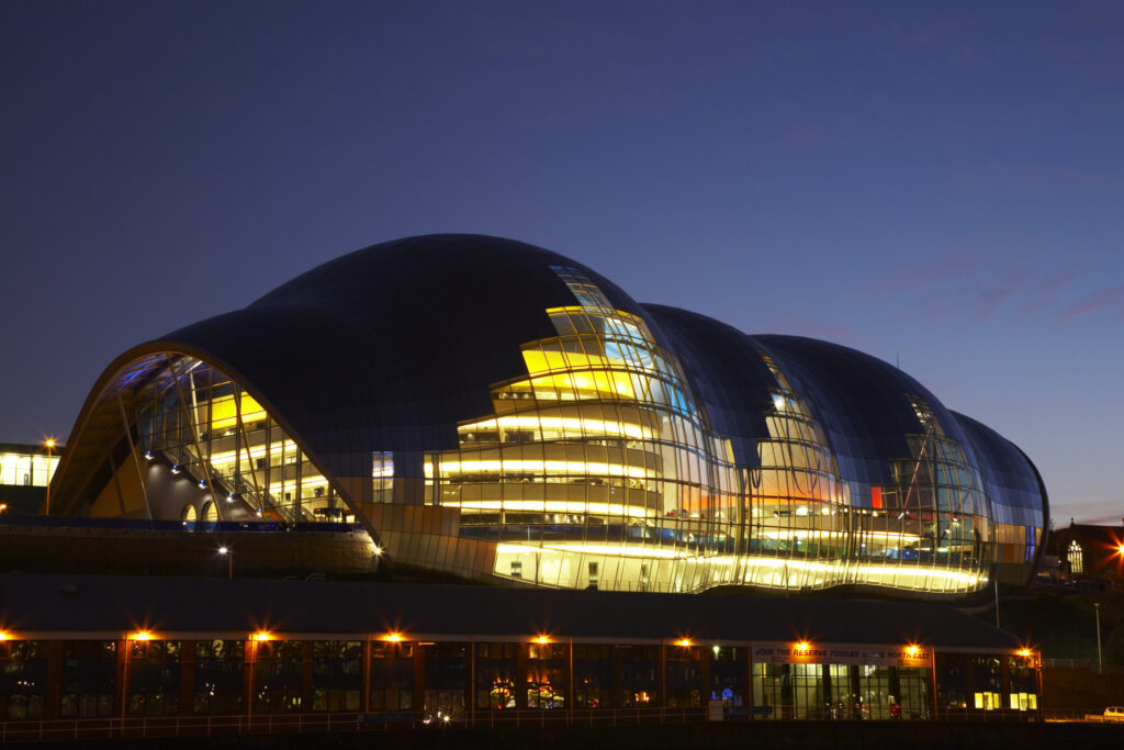 The Sage gateshead building, viewed at night from the Newcastle Upon Tyne quayside.