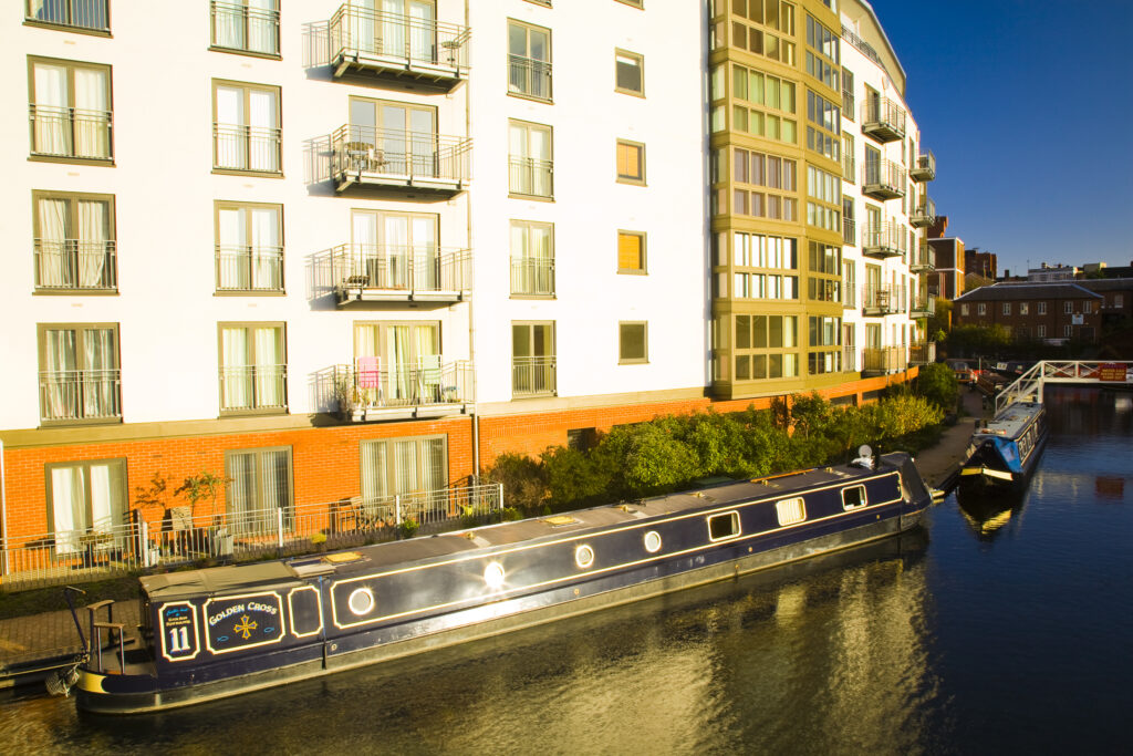 England, West Midlands, Birmingham City. Canal boat moored on King Edwards Wharf.