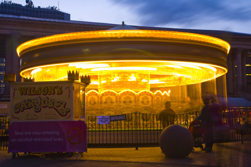 England, West Midlands, Birmingham City. Carousel at the Frankfurt Christmas Market held at Victoria Square and Upper New Street in Birmingham City Centre.