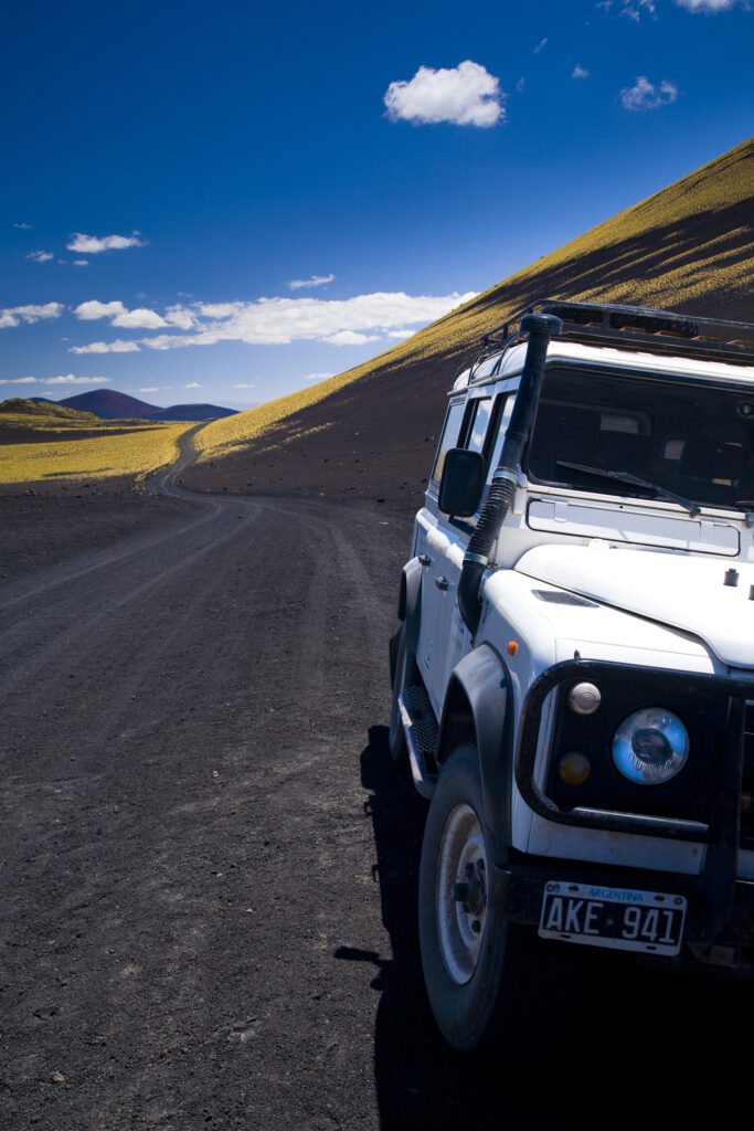 Argentina, Mendoza, Parque Provincial Payunia. Tourist sight seeing 4 wheel drive jeep used to explore the reserve.