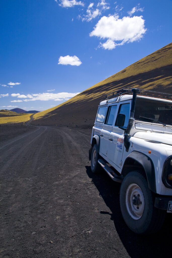 Argentina, Mendoza, Parque Provincial Payunia. Tourist sight seeing 4 wheel drive jeep used to explore the reserve.