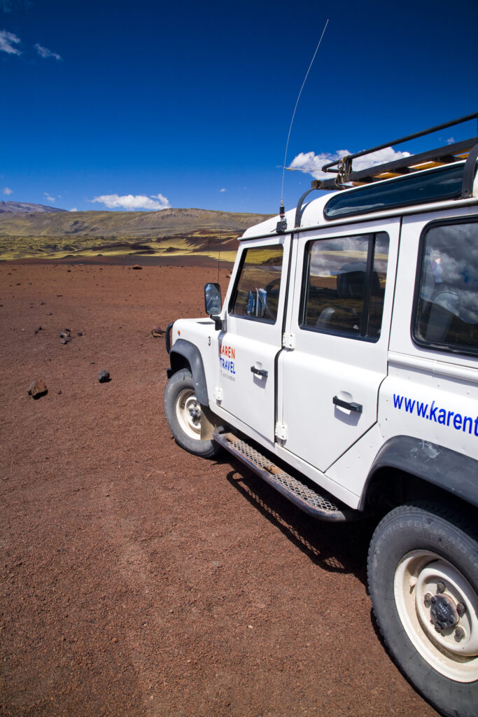 Argentina, Mendoza, Parque Provincial Payunia. Tourist sight seeing 4 wheel drive jeep used to explore the reserve.