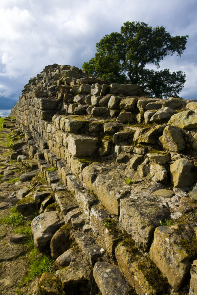 England, Cumbria, Gilsland. Hadrians Wall path running alongside Hadrians Wall - part of the Hadrians Wall UNESCO World Heritage Site.