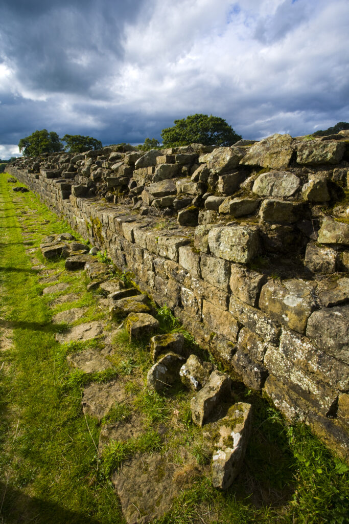 England, Cumbria, Gilsland. Hadrians Wall path running alongside Hadrians Wall - part of the Hadrians Wall UNESCO World Heritage Site.