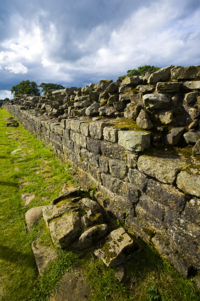 England, Cumbria, Gilsland. Hadrians Wall path running alongside Hadrians Wall - part of the Hadrians Wall UNESCO World Heritage Site.