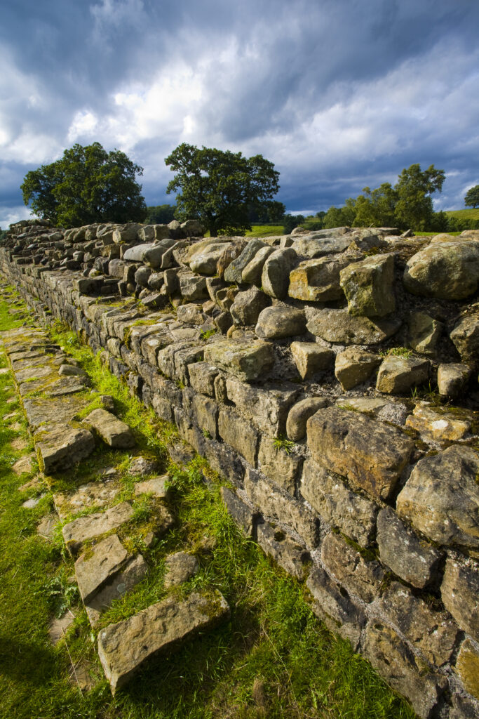 England, Cumbria, Gilsland. Hadrians Wall path running alongside Hadrians Wall - part of the Hadrians Wall UNESCO World Heritage Site.