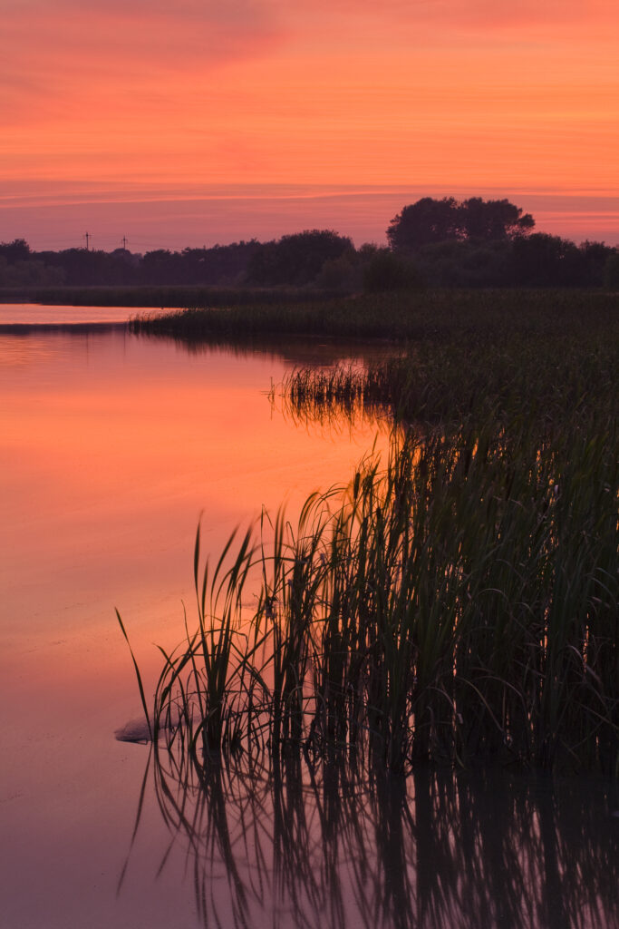 England, Tyne and Wear, Big Waters County Park. Sunset over the lake in Big Waters Country Park The lake is a a subsidence pond, formed by the collapse of old mine workings.