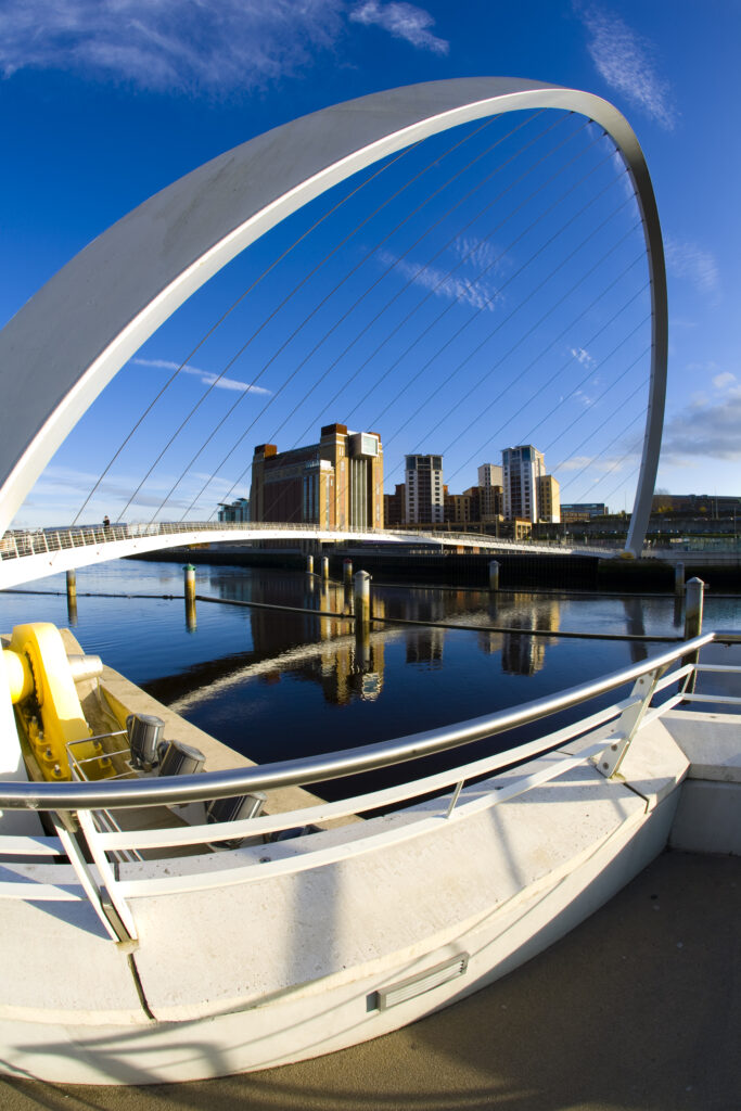 England, Tyne and Wear, Newcastle Upon Tyne. The Gateshead Millennium Bridge and Baltic Gllery on the Newcastle upon Tyne river quayside.