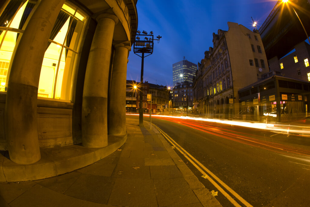 England, Tyne and Wear, Newcastle Upon Tyne. Busy road at dusk alongside the Guildhouse in Newcastle City Centre.