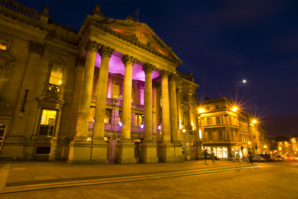 England, Tyne and Wear, Newcastle Upon Tyne. The Grade I listed Theatre Royal photographed at night. Opened in February 1837, the Theatre Royal dominates the heart of Newcastle’s Grainger Town.