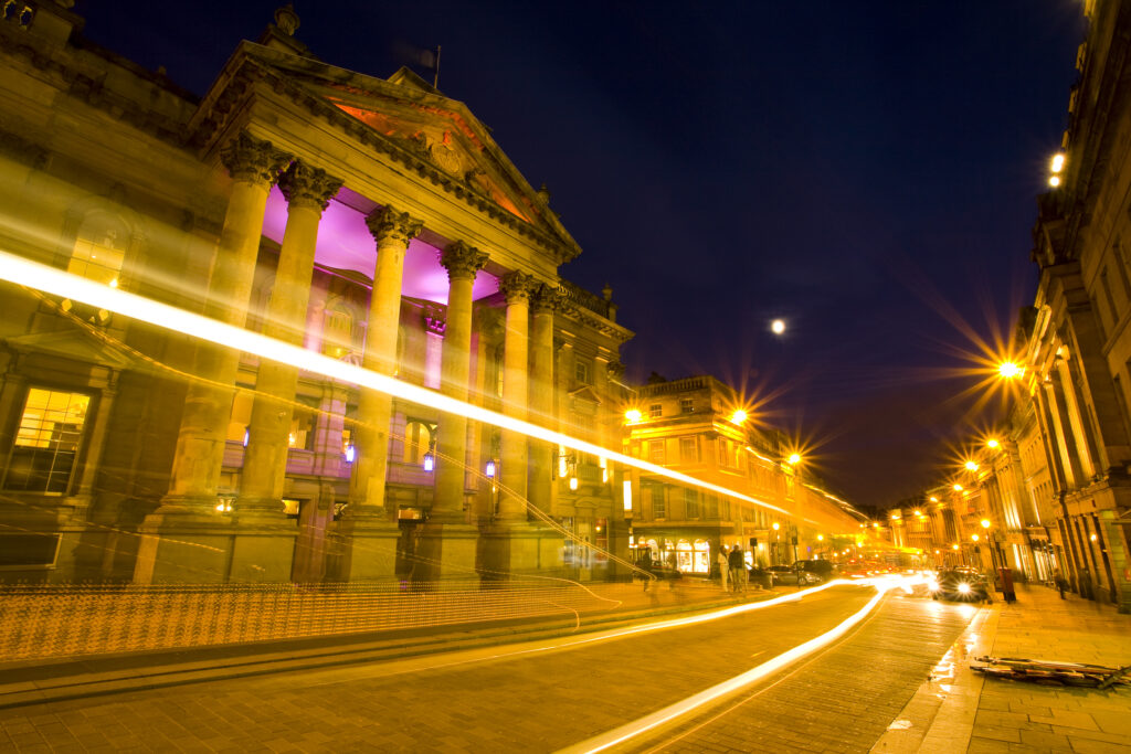 England, Tyne and Wear, Newcastle Upon Tyne. The Grade I listed Theatre Royal photographed at night. Opened in February 1837, the Theatre Royal dominates the heart of Newcastle’s Grainger Town.
